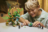 Child playing with toy dragon set on a table