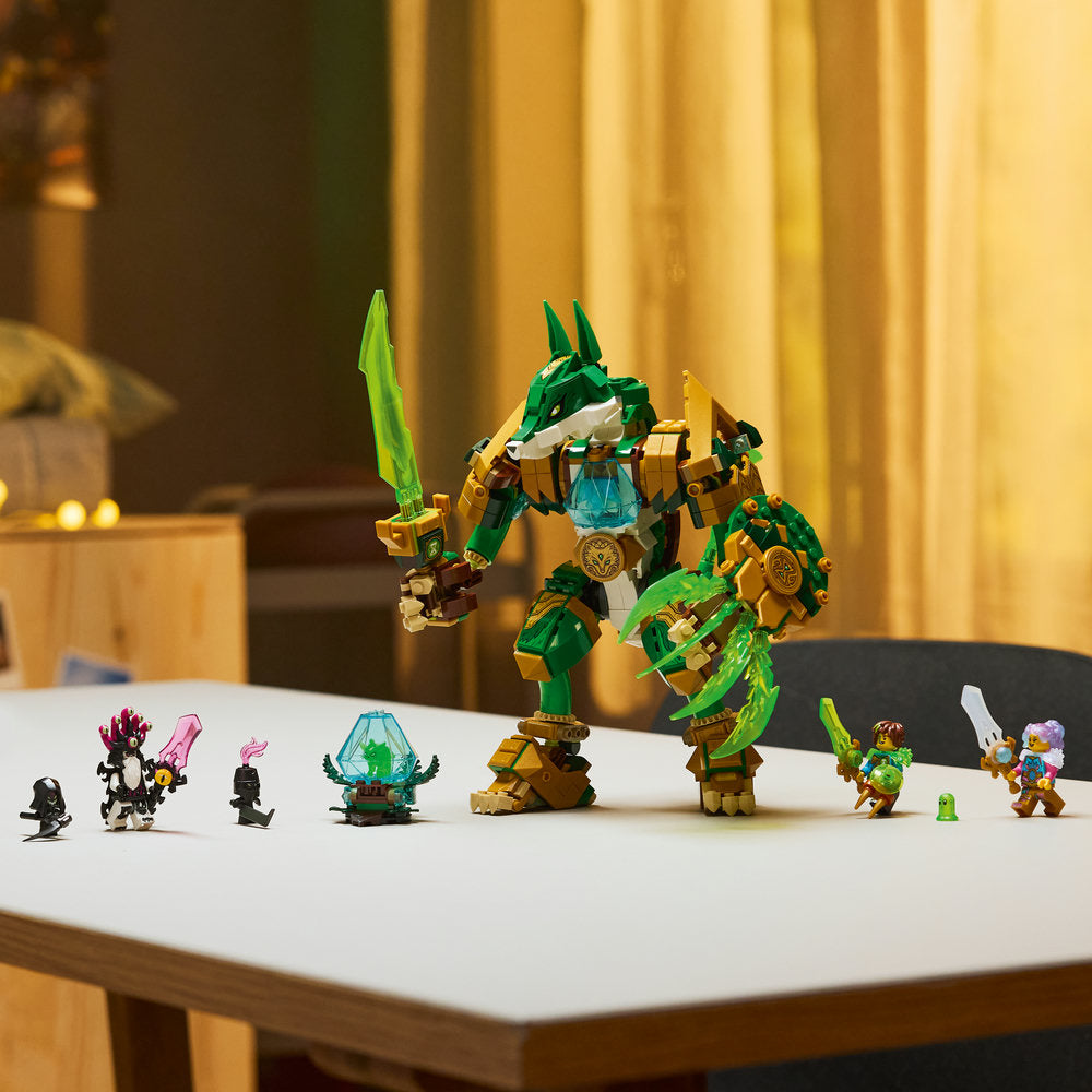 Toy dragon figure with smaller characters on a table
