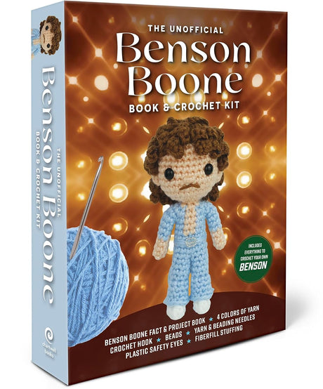 The Unofficial Benson Boone Book & Crochet Kit box shown at a three-quarter angle on a plain white background. The front cover features a crocheted character in light blue pajamas against a warm orange bokeh background, with a blue ball of yarn and crochet hook on the left and a green circular badge on the right.