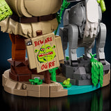 Toy figure with a sign warning 'Beware of Ogre' and a robot-like creature in the background.