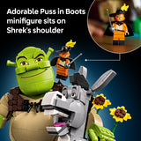 LEGO Shrek with Puss in Boots minifigure on his shoulder against a dark blue background.