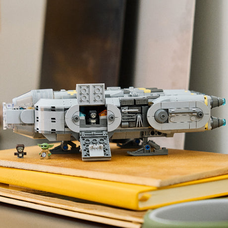 Toy spaceship model on a stack of books with a blurred background