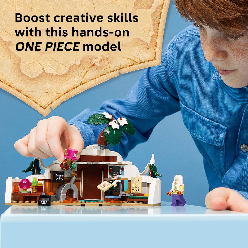 Child playing with a One Piece model set on a blue background