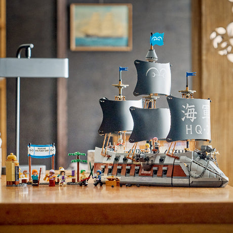 Toy pirate ship with figures on a wooden surface, framed by a painting in the background.