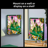 Decorative wall art with a castle design displayed on a shelf and wall.