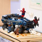 LEGO set with Spider-Man and other characters on a vehicle, on a desk.