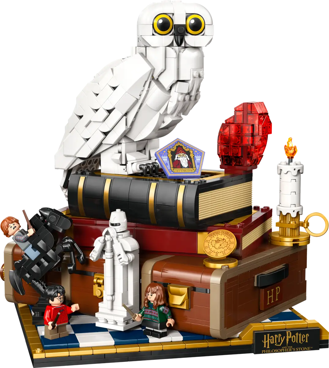 LEGO Harry Potter set with owl, books, and characters on a white background