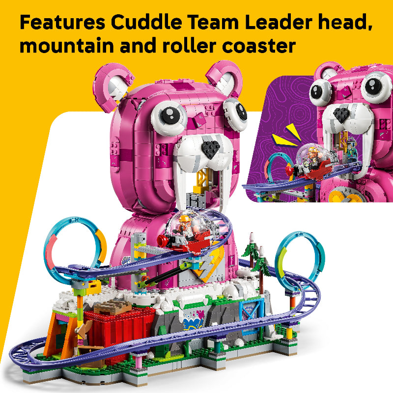 Toy set with pink character, mountain, and roller coaster on a yellow background
