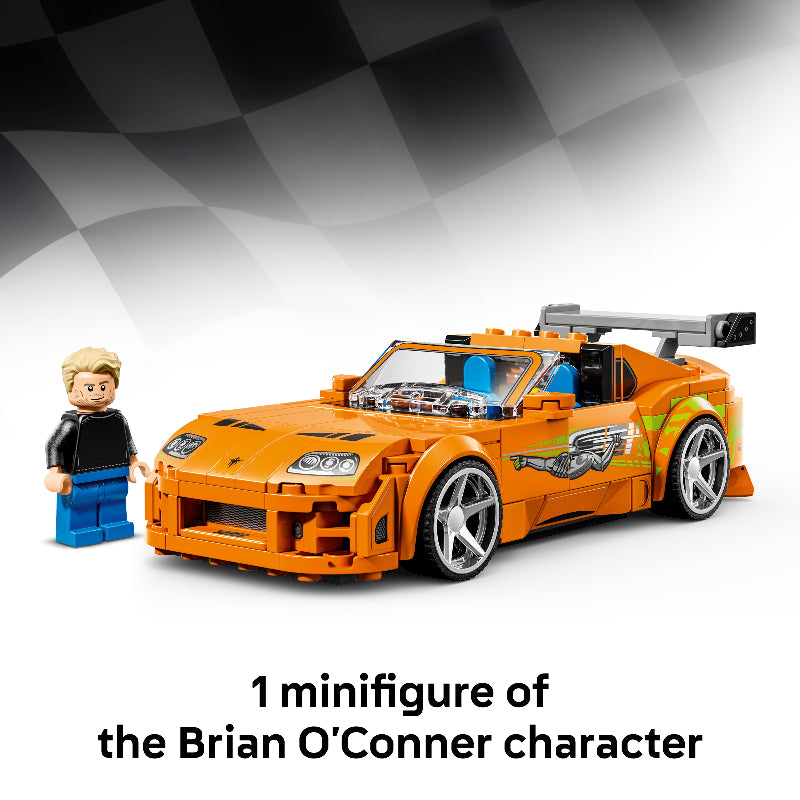 LEGO model of a sports car with a minifigure next to it on a checkered background