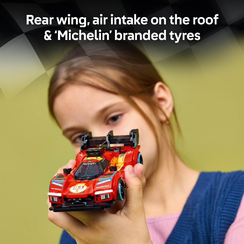 Person holding a red toy car with text about car features and Michelin branding.