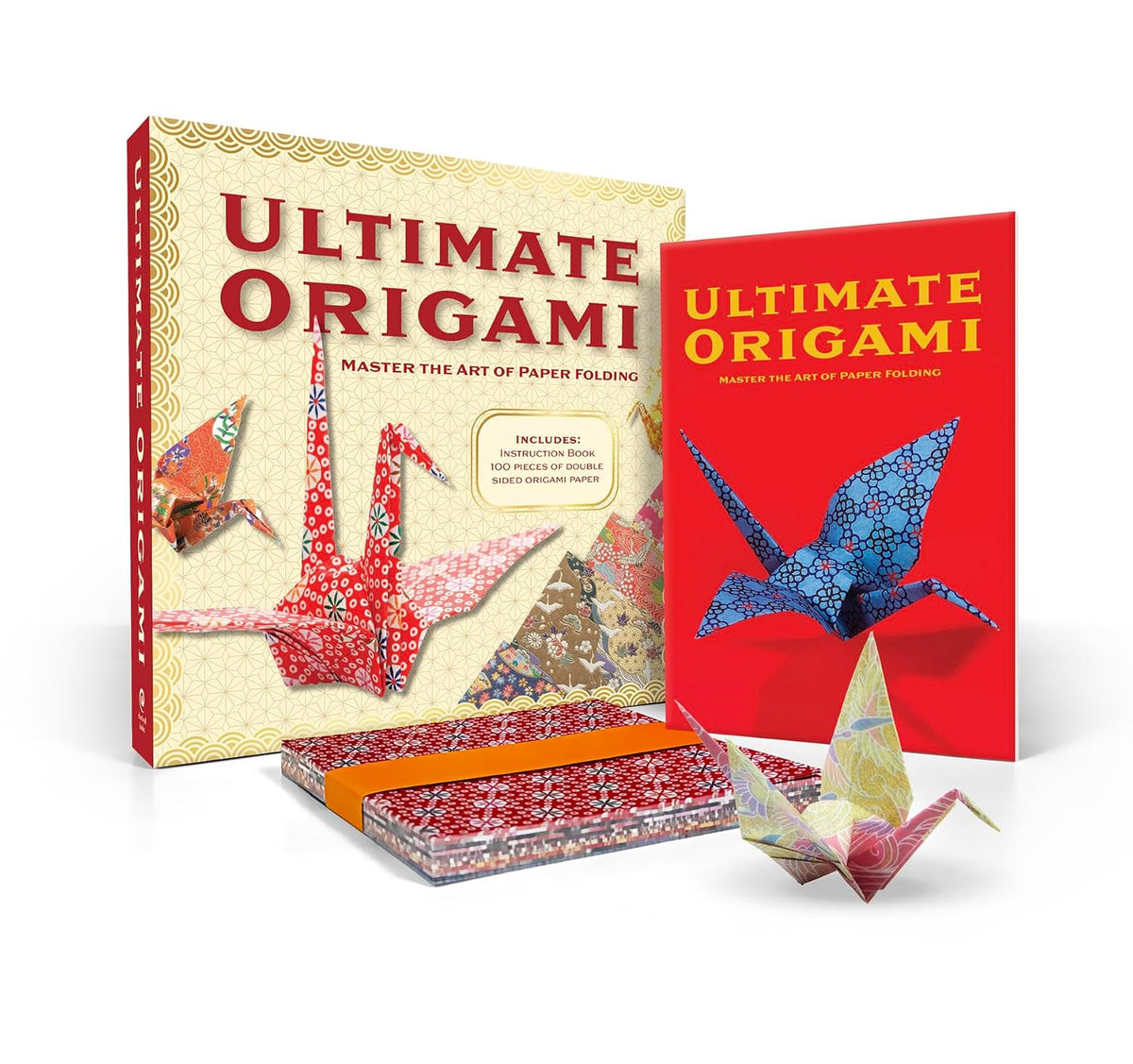 Ultimate Origami instruction book box shown at a three-quarter angle on a white background. The box features a cream-colored background with a gold wave pattern, bold red title text, and illustrations of colorful origami cranes.