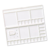 White paint palette with multiple compartments on a white background