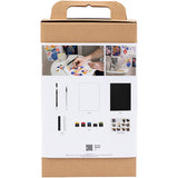 Cardboard box packaging for an art set with images of art supplies on a white background