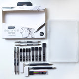 A 17-piece mechanical pencil collection set by Diagrams, neatly arranged on a white surface next to its clear plastic storage case. The set includes various silver and black mechanical pencils, ink cartridges, an eraser, and a color wheel, with the branded retail box visible in the upper left.