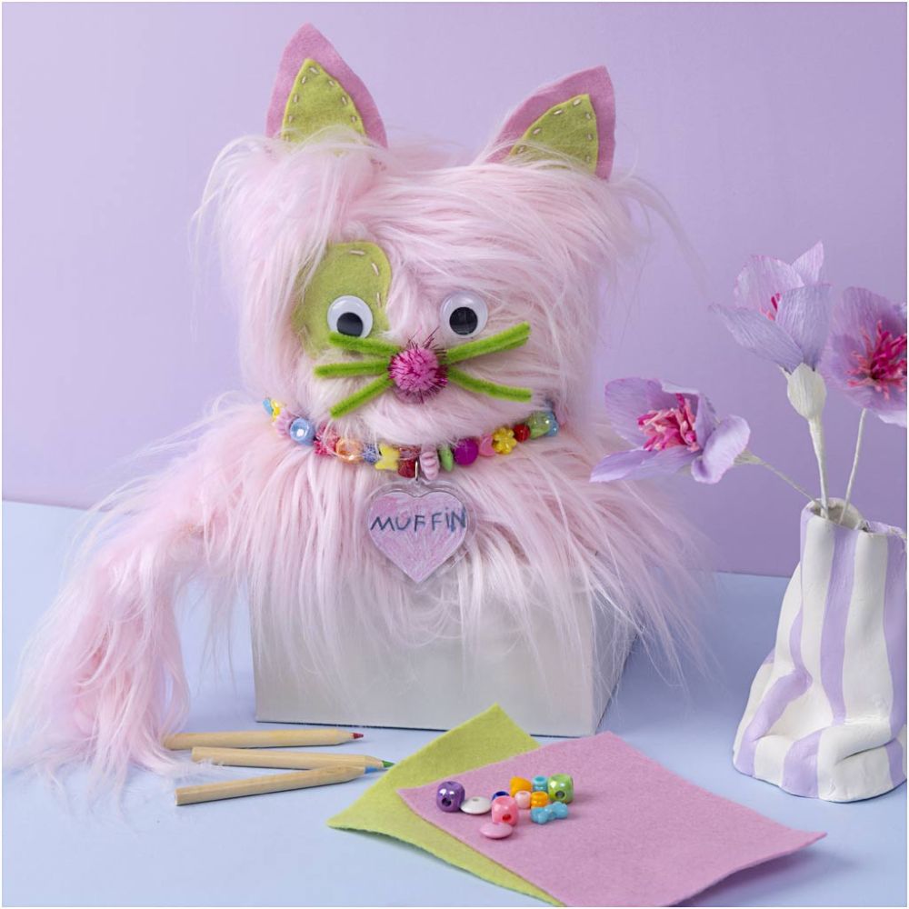 Pink fluffy cat with green accents and a 'Muffin' heart tag on a light purple background.