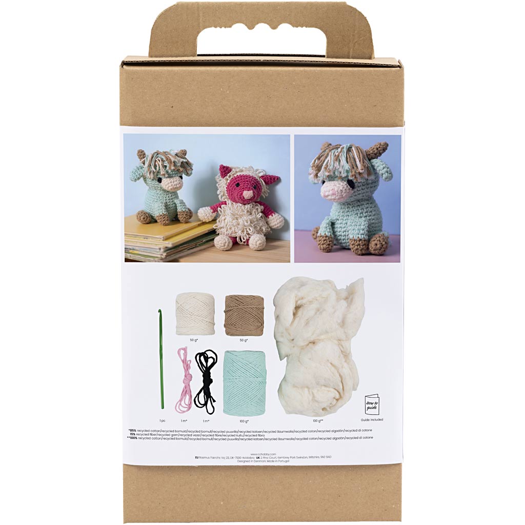 Knitting kit packaging with yarn, needles, and crochet patterns on a white background