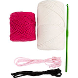 Two balls of yarn, a crochet hook, and a piece of string on a white background