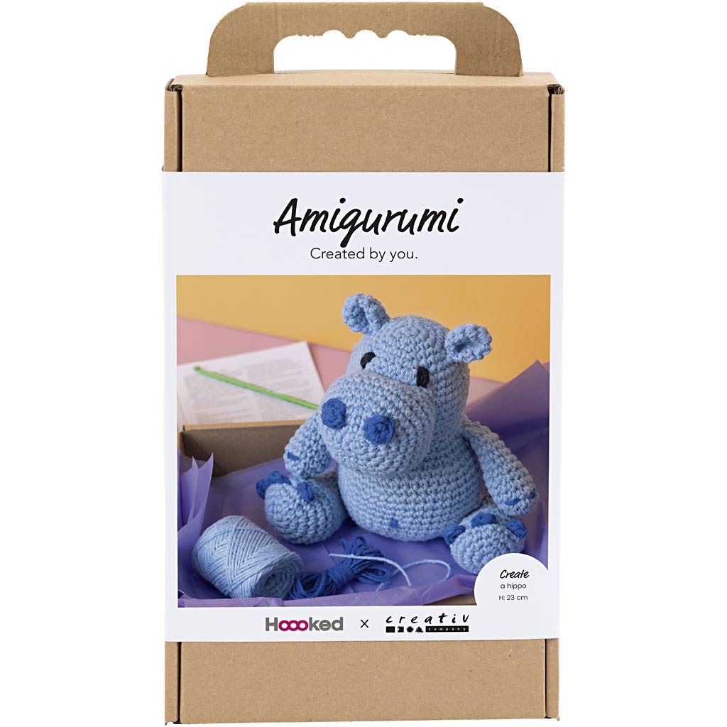 Crocheted hippo toy in a 'Amigurumi' packaging with 'Hoooked' branding.