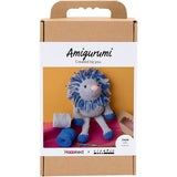 Amigurumi lion toy packaging with 'Amigurumi Created by you' text on a white background
