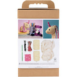 Crochet kit packaging with yarn, hooks, and finished unicorn toys on a white background
