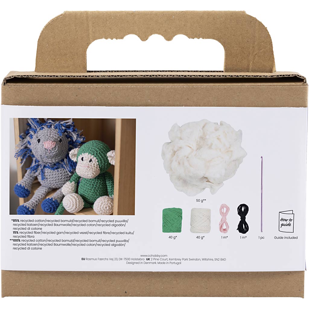 Knitting kit packaging with yarn and tools on a white background