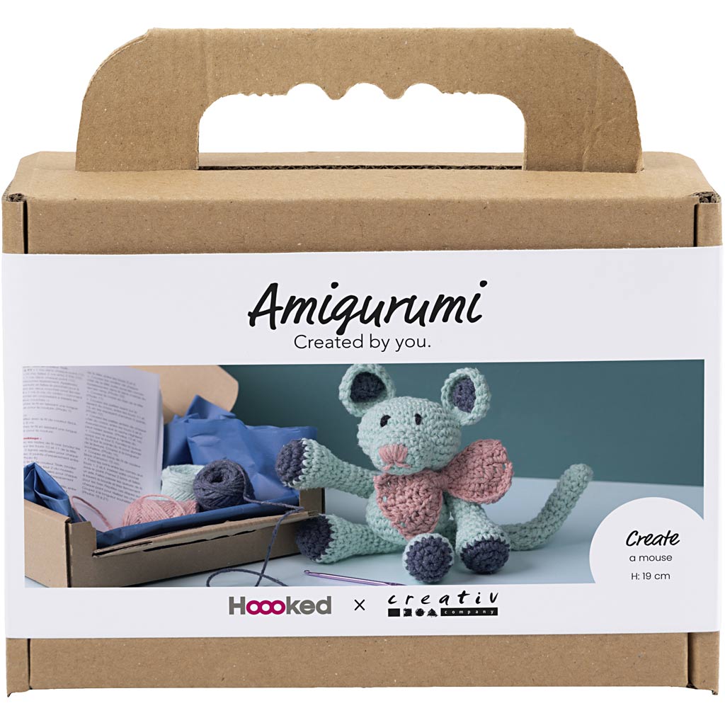 Amigurumi kit packaging with a crocheted mouse toy and crafting materials.