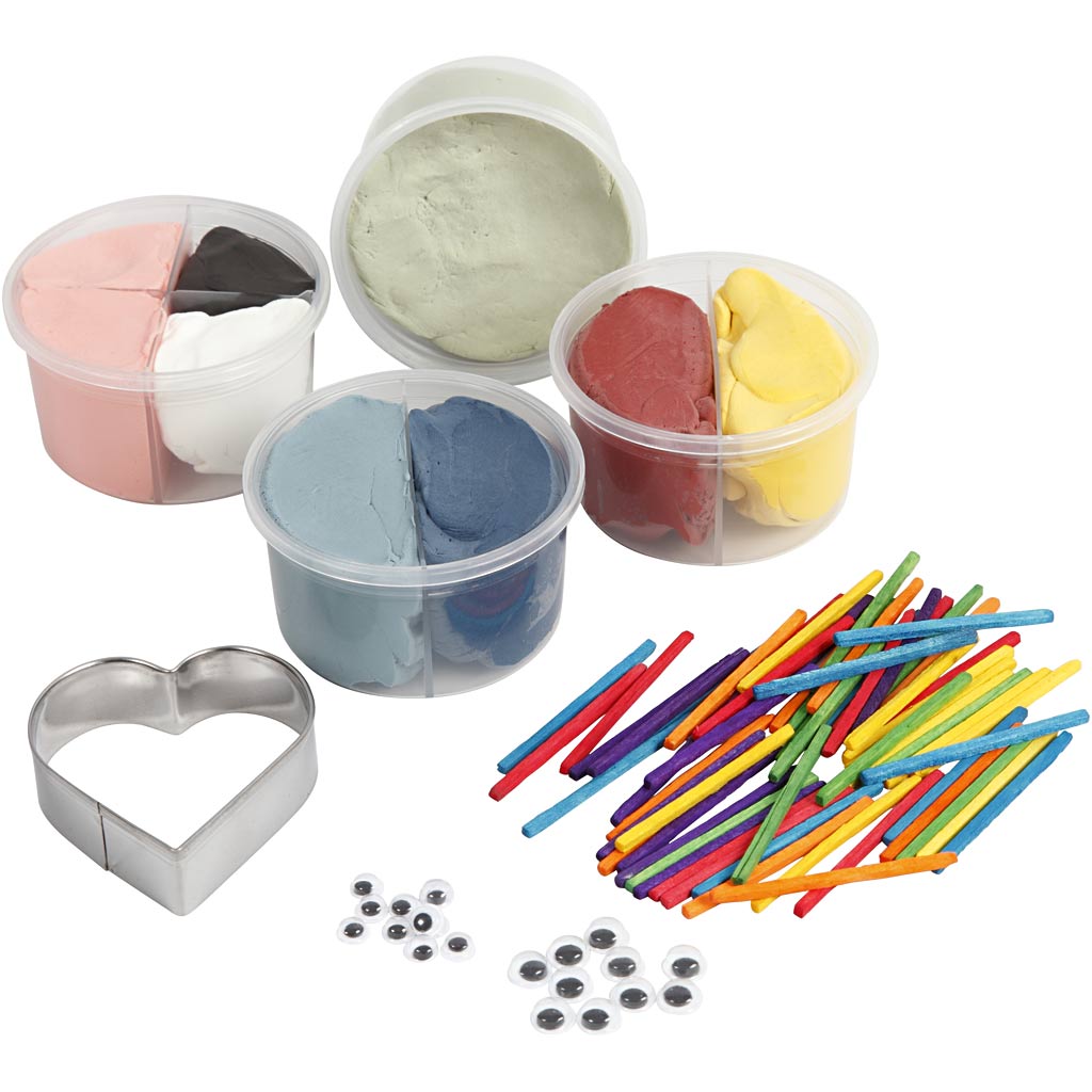 Set of assorted coloured clay in containers with tools on a white background