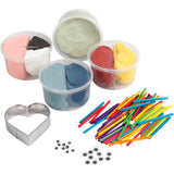 Set of assorted coloured clay in containers with tools on a white background