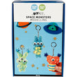 Box of DIY space monsters modelling kit with colorful monsters on a blue background