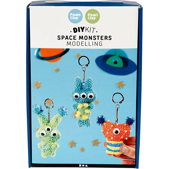 Box of DIY space monsters modelling kit with colorful monsters on a blue background