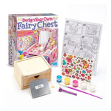 Children's craft kit with wooden chest, paint supplies, and coloring pages on a white background