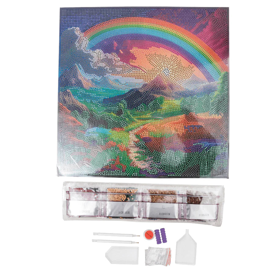 Diamond painting kit with a colorful mountain and rainbow design on a white background.