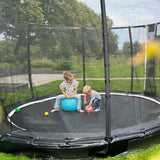 Exit Premium Ground Round Trampoline Black outside in the garden