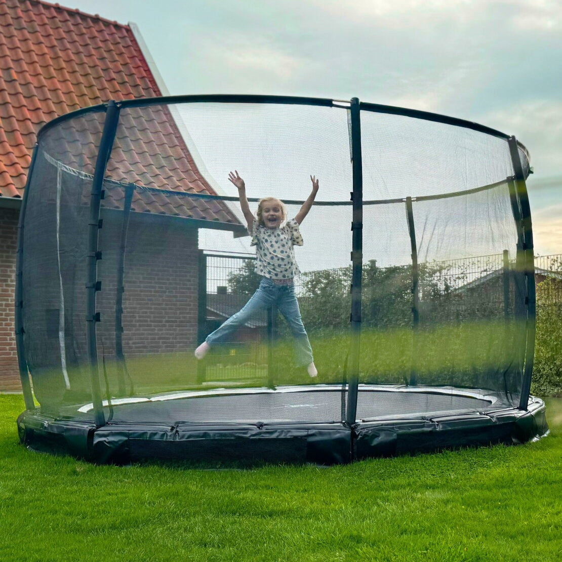 Exit Premium Ground Round Trampoline Black outside in the garden
