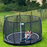 Exit Premium Ground Round Trampoline Black outside in the garden
