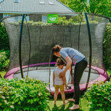 Exit Silhouette Ground Trampoline in Pink Outside Garden