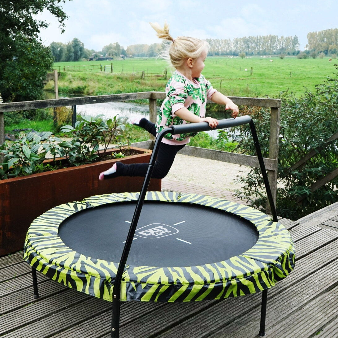 Little gitrl jumping on an Exit Tiggy Junior Trampoline 