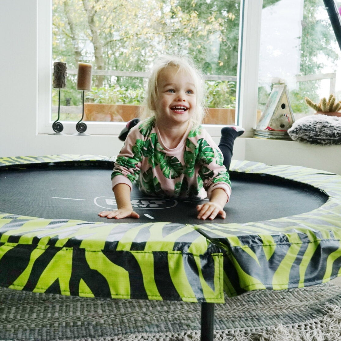 Toddler indoors on an Exit Tiggy Junior Trampoline 