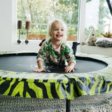 Toddler indoors on an Exit Tiggy Junior Trampoline 