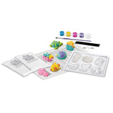 Children's craft kit with moldable clay, tools, and coloring supplies on a white background