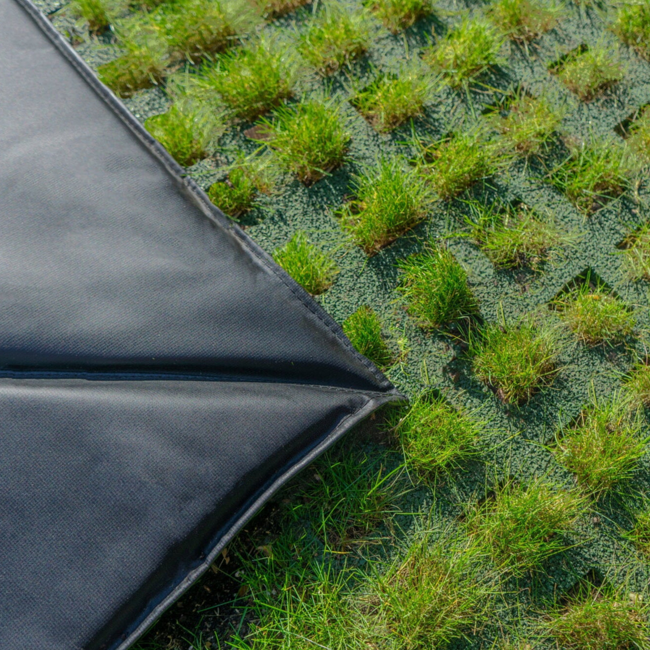 Freezone tiles in the grass with Groundlevel trampoline