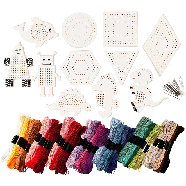 Cross-stitching kit with pre-cut patterns, colorful threads, and tools on a white background