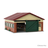 Model of a barn with red roof and brick walls on a white background