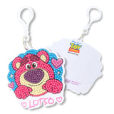 Keychain with a colorful bear design and 'Toy Story' branding on a white background
