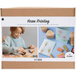 Foam printing kit packaging with child using tools and printed designs.