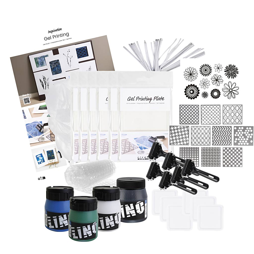 Gel printing kit with supplies including plates, stencils, and ink containers on a white background.