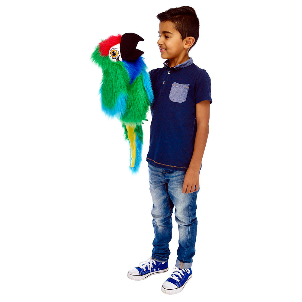 Child holding a colorful parrot plush toy on a white background