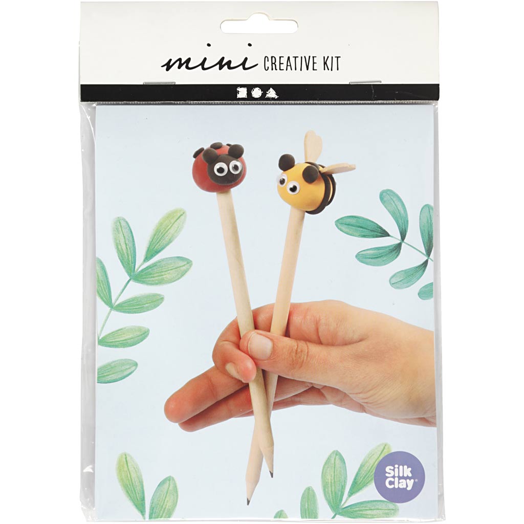 Silk Clay mini creative kit packaging with ladybug and bee-themed pencil toppers held by a hand.