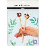 Silk Clay mini creative kit packaging with ladybug and bee-themed pencil toppers held by a hand.