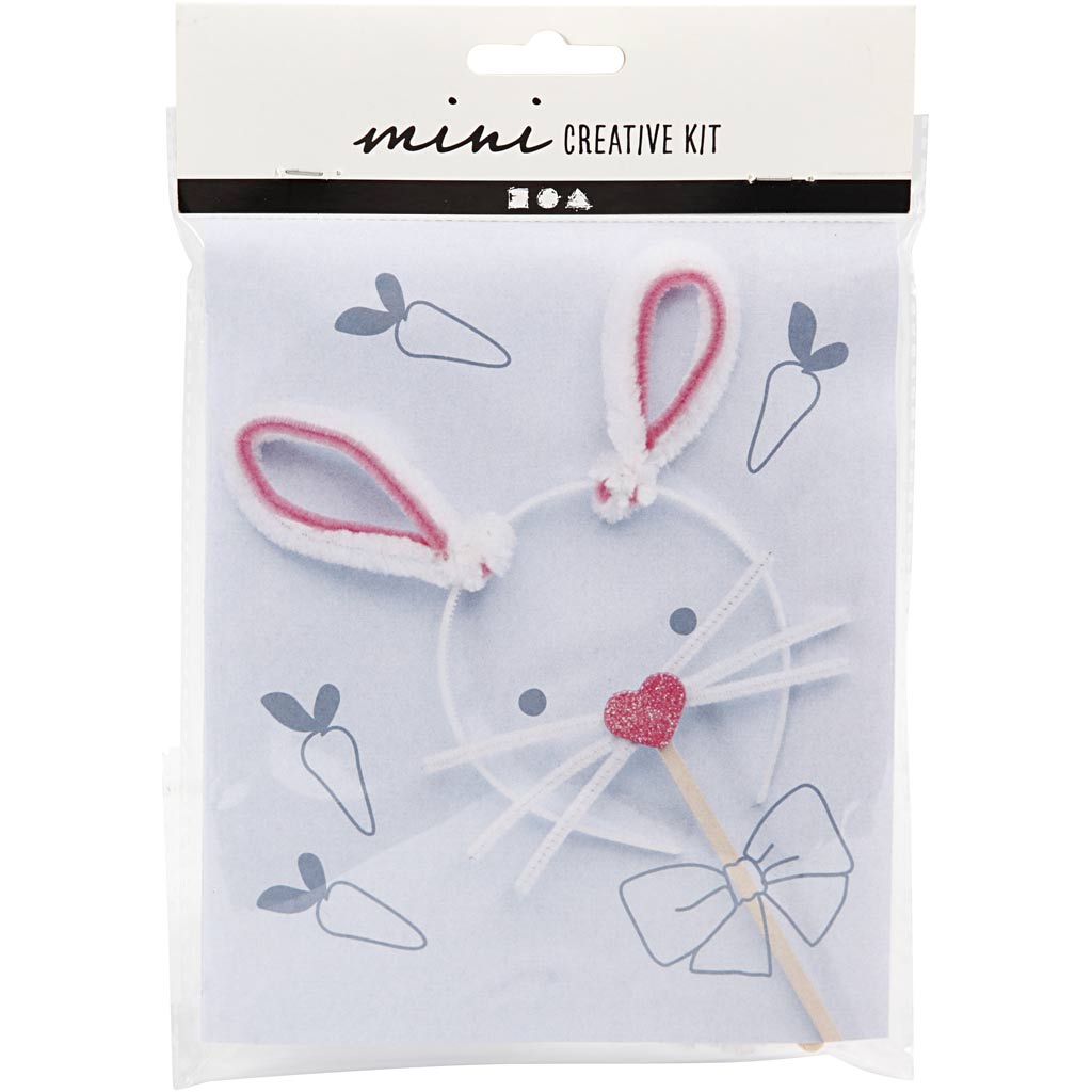 Mini creative kit with bunny ears and bow on a white background